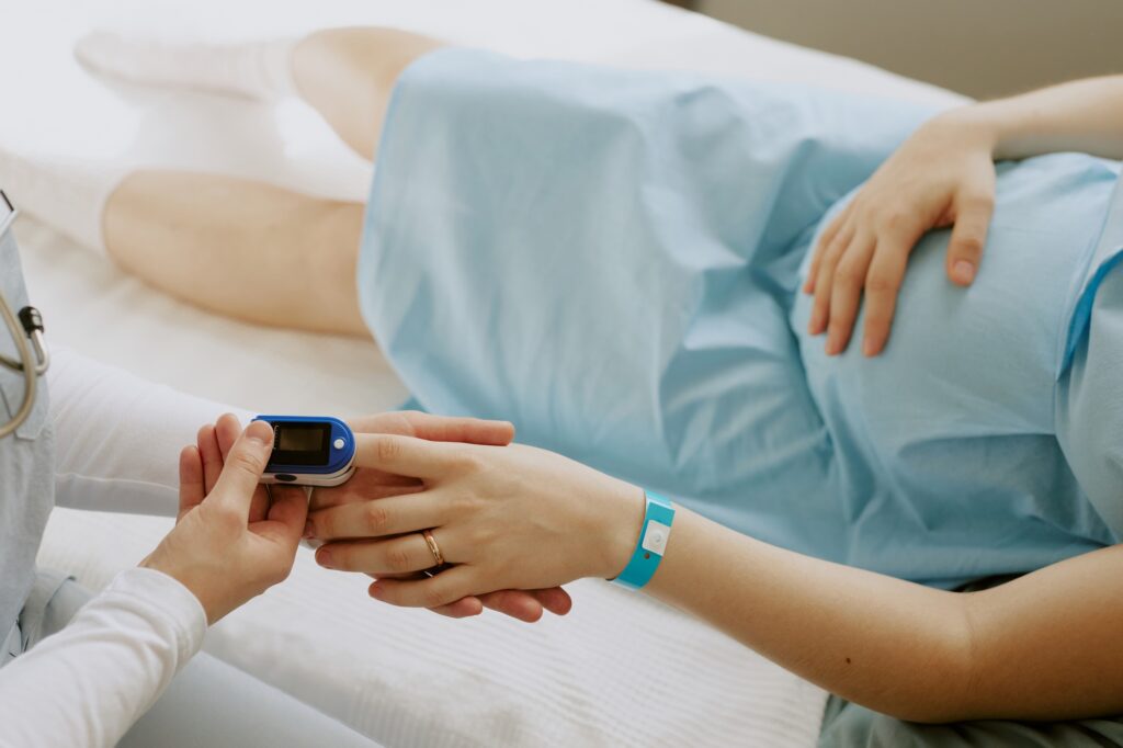 Midwife Checking Up Patients Saturation